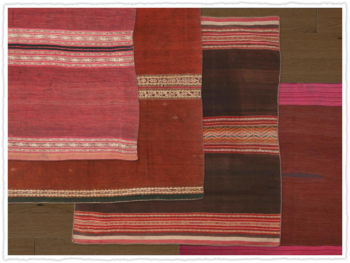 A selection of Aymara blankets in rich reds and burgundies